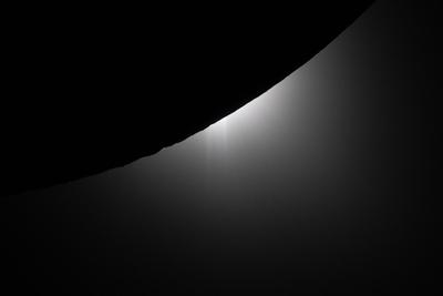 Sun peeking around the Moon limb